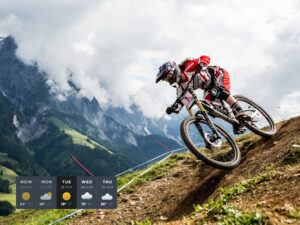 Downhill mountain biker riding a steep mountain trail, featured alongside a custom 5-day weather forecast widget UI overlay in the bottom left corner.