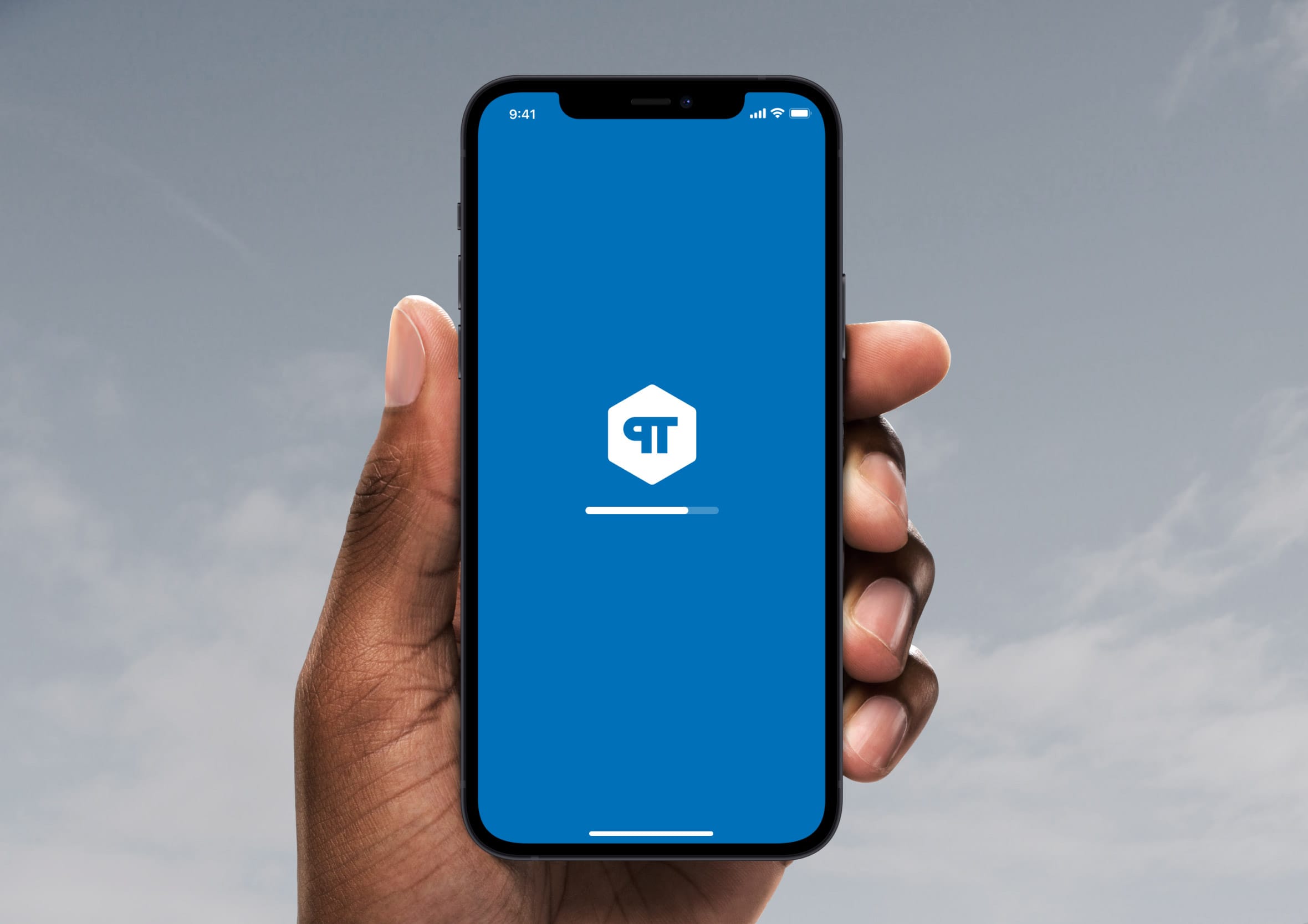 Hand holding an iPhone displaying a blue splash screen with a loading progress bar.