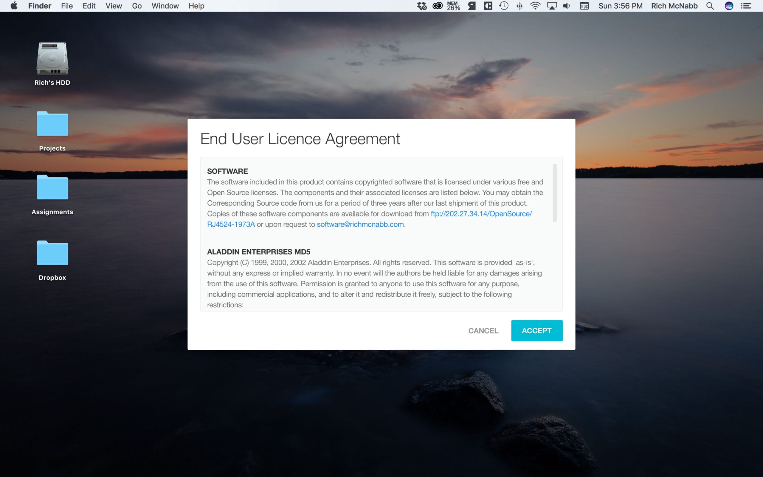 Desktop screen showing an End User License Agreement modal pop-up window over a scenic sunset background.