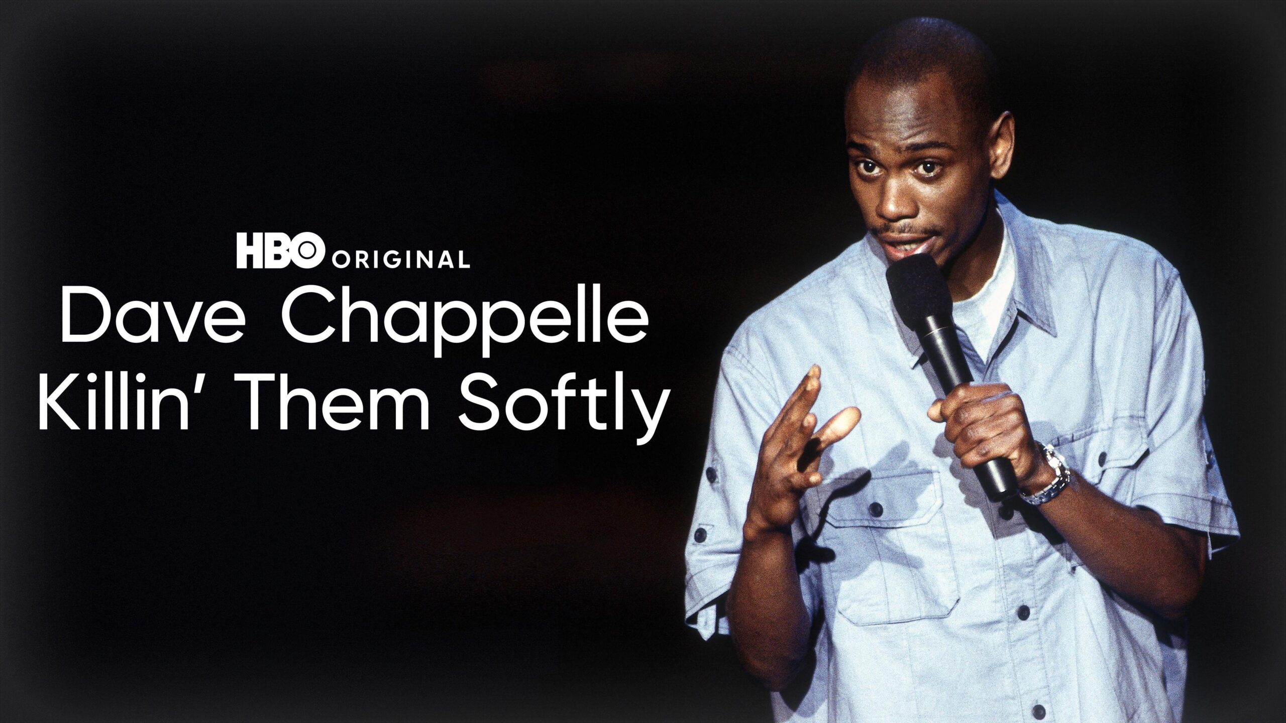Promotional poster for Dave Chappelle's stand-up comedy special Killin' Them Softly showing Chappelle gesturing on stage.
