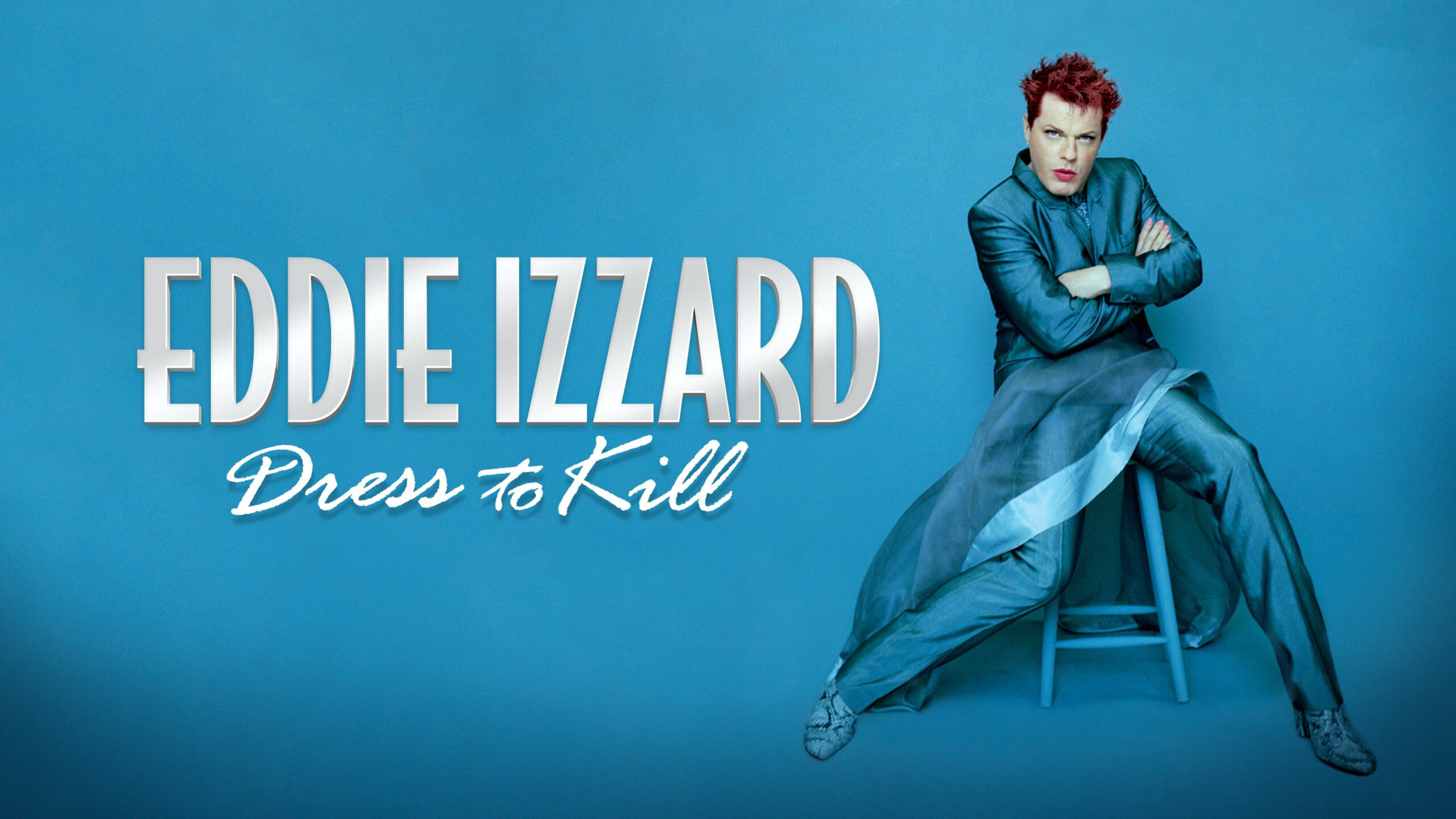 Album cover for Eddie Izzard's stand-up comedy special Dress to Kill on a bright blue backdrop.