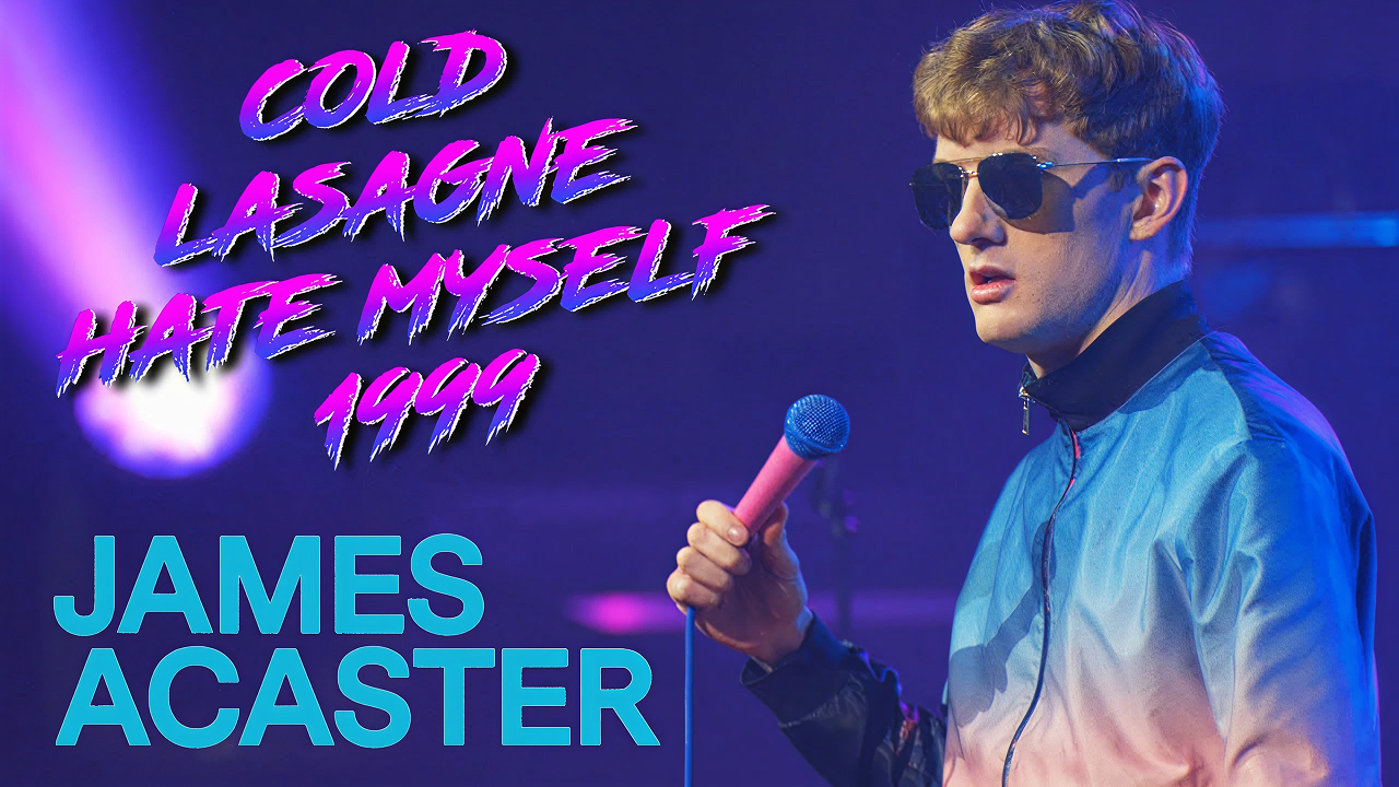 Promotional visual for James Acaster's stand-up comedy special Cold Lasagne Hate Myself 1999 showing Acaster on stage in a colourful jacket.