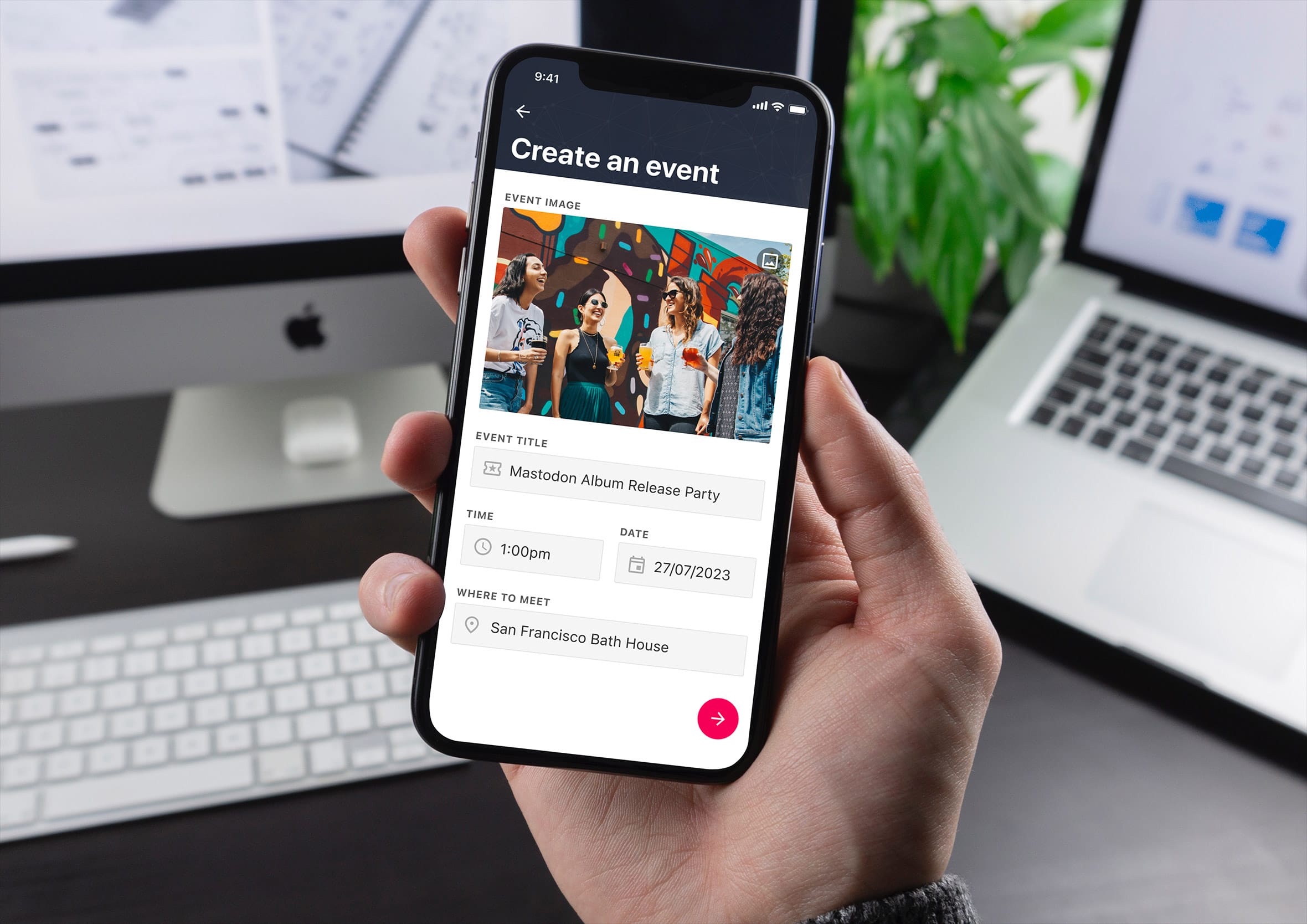 Hand holding an iPhone displaying an event creation form with image upload and detail fields.