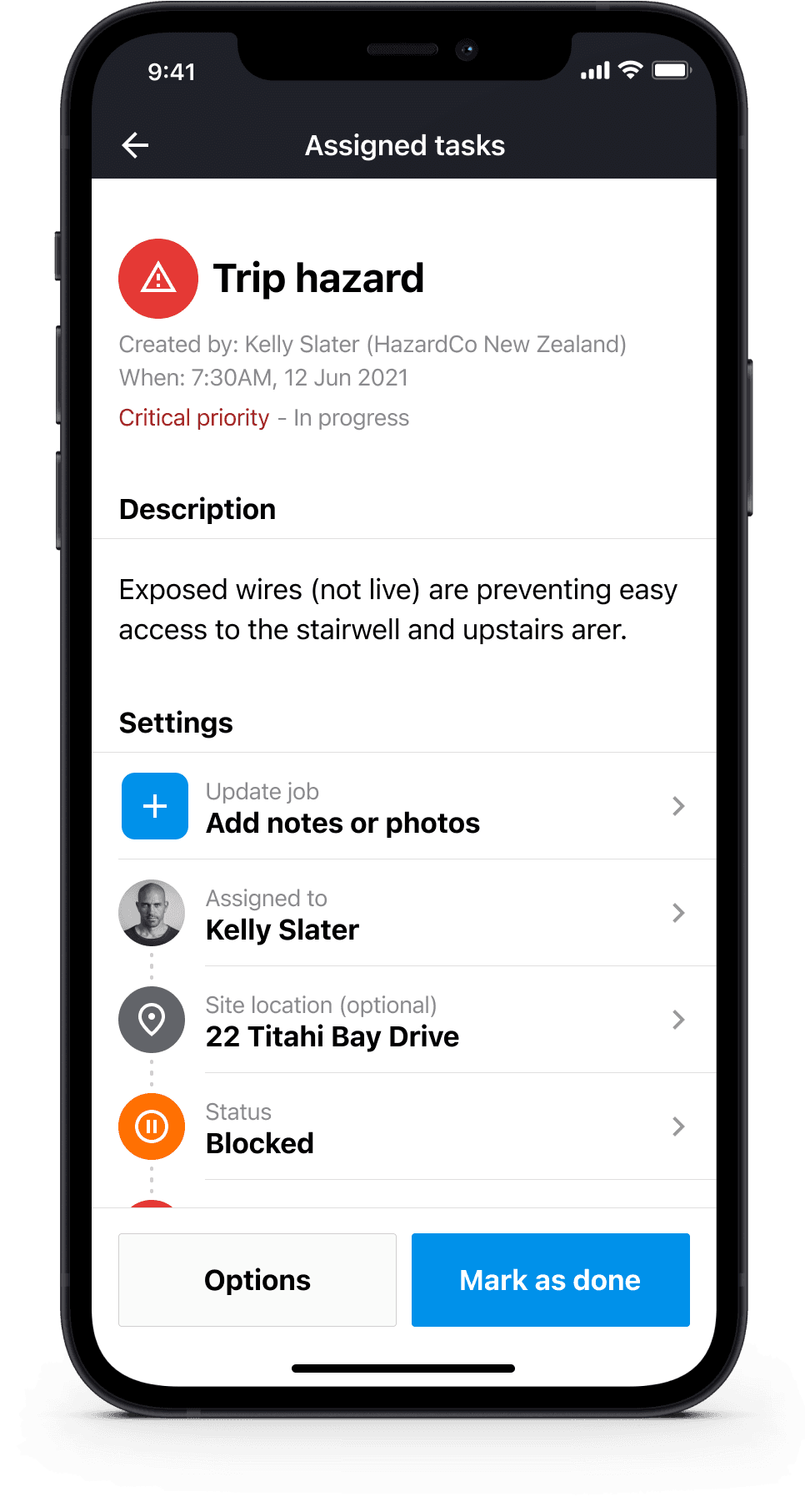 Detailed task screen showing hazard description, assigned contact, location, and status controls.