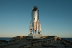 Rocket launching into the sky, representing growth and ambition in a design career