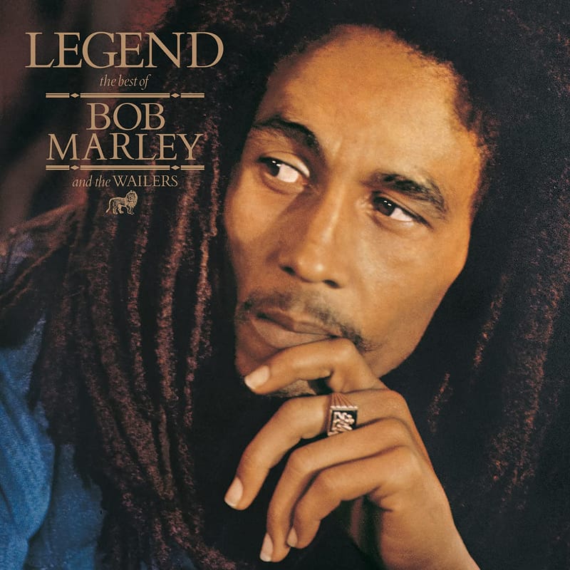 Classic portrait artwork for Bob Marley and the Wailers' Legend, showing Marley resting his chin on his hand.