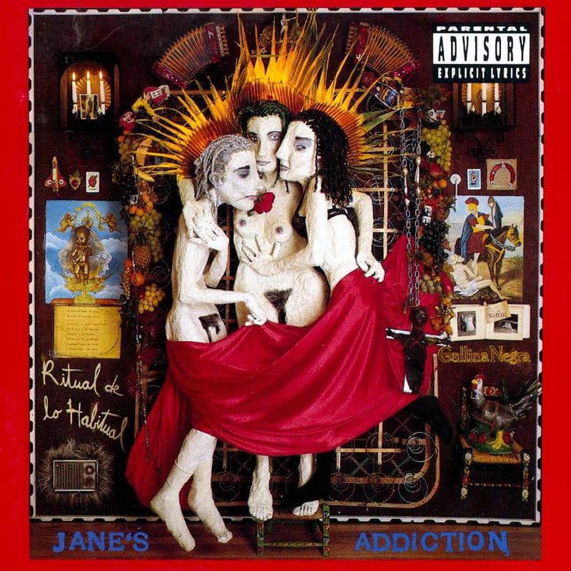 Cover artwork for Jane's Addiction's Ritual de lo Habitual, featuring colorful papier-mâché sculptures arranged on an altar.