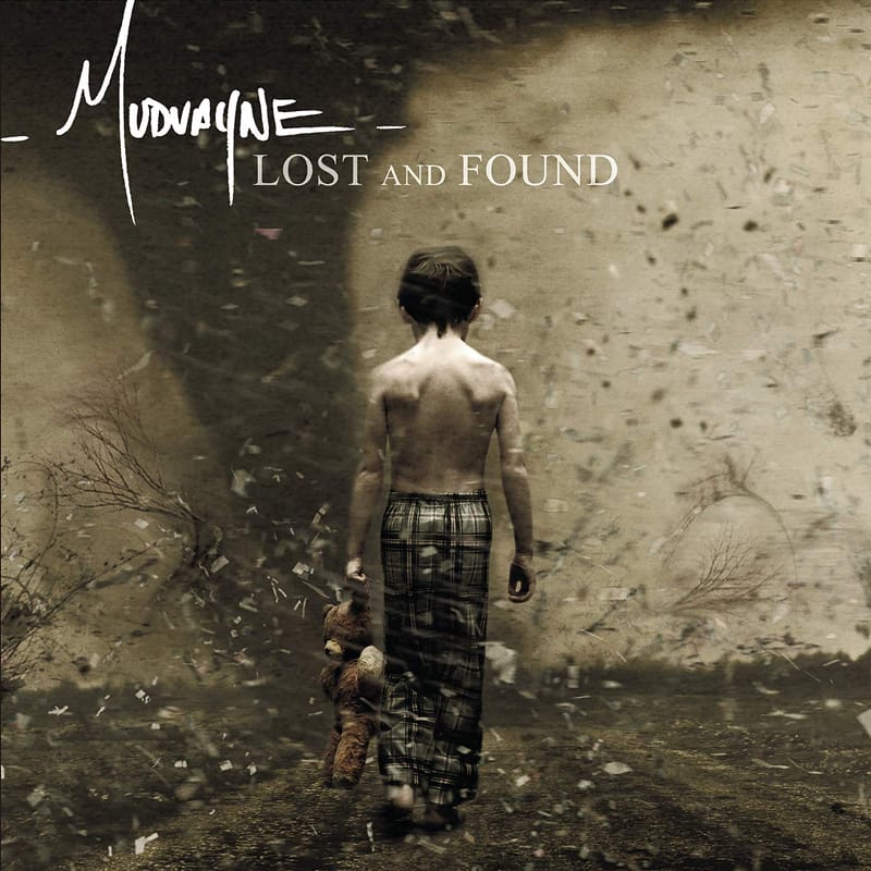 Album cover photo for Mudvayne's Lost And Found, showing a child standing in a rustic doorway against distressed walls.