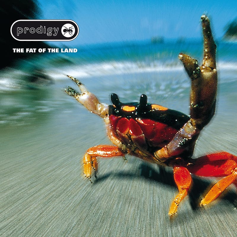 Front cover photo for The Prodigy's The Fat of the Land, featuring a fiddler crab on a sandy beach.