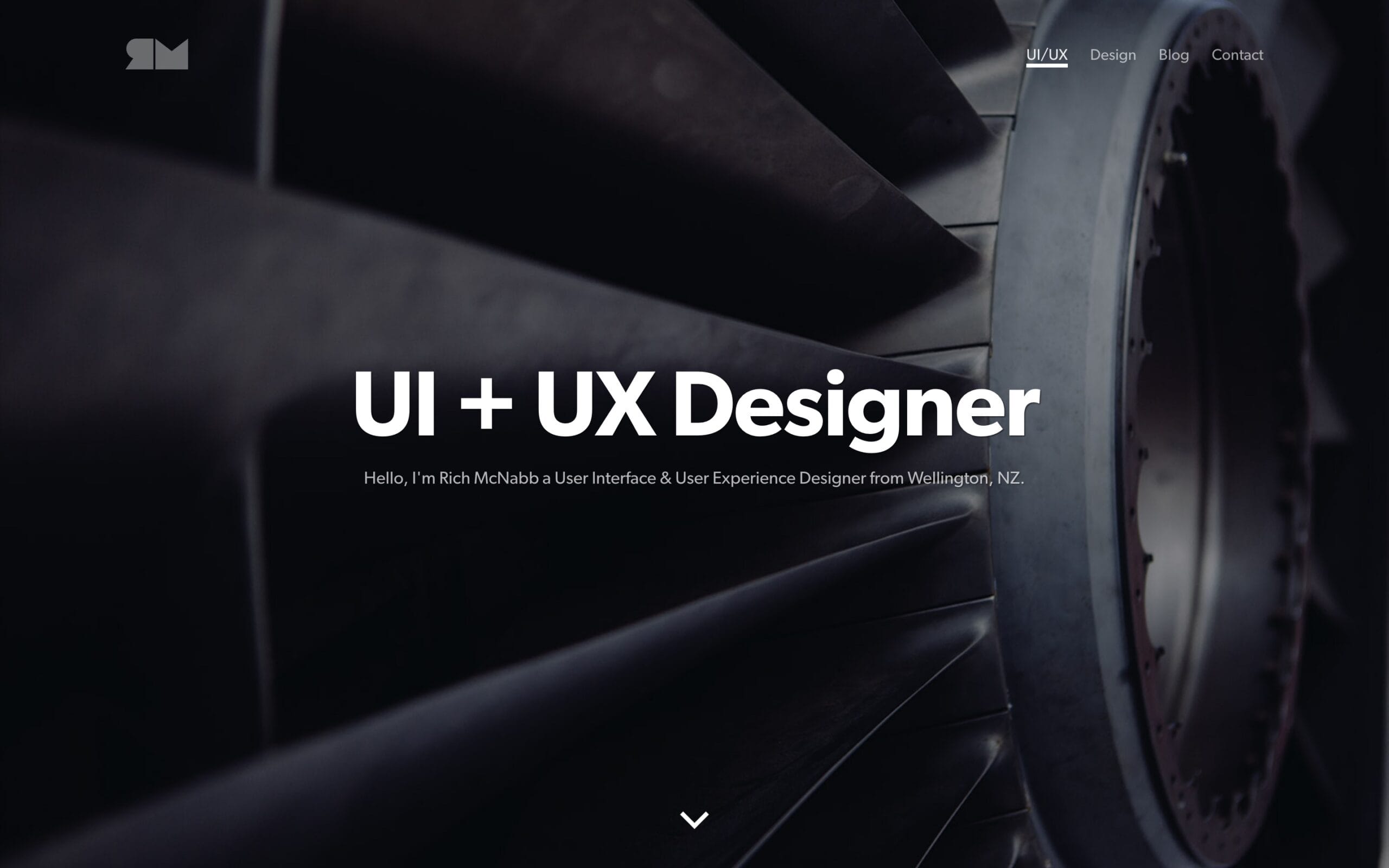 Modern portfolio homepage screenshot featuring a full-screen dark turbine graphic overlaid with bold white text reading UI + UX Designer, illustrating portfolio visual evolution.