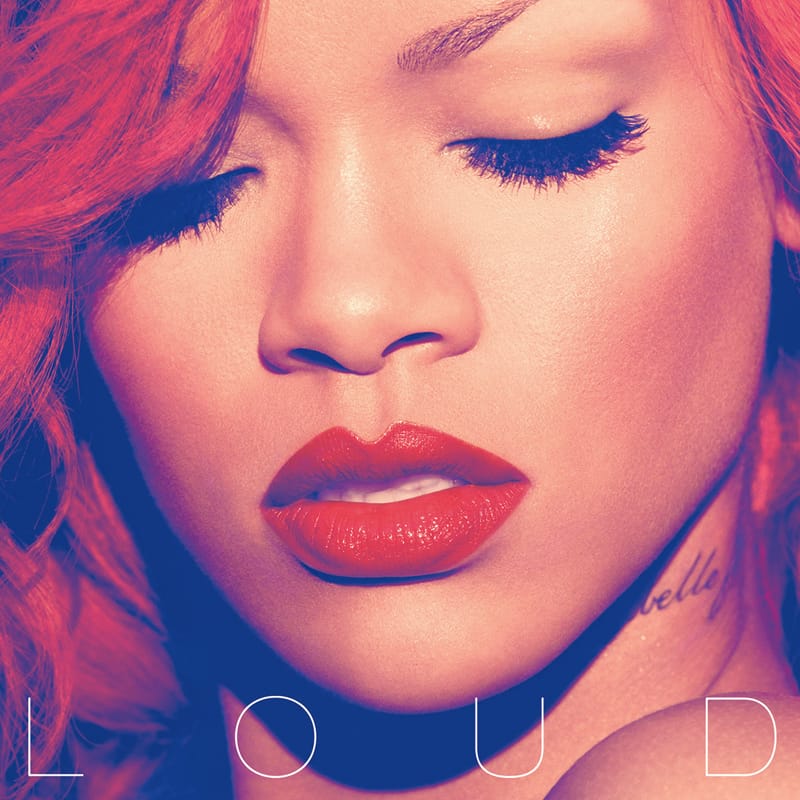 Close-up portrait cover for Rihanna's Loud, featuring her vibrant fiery red hairstyle.
