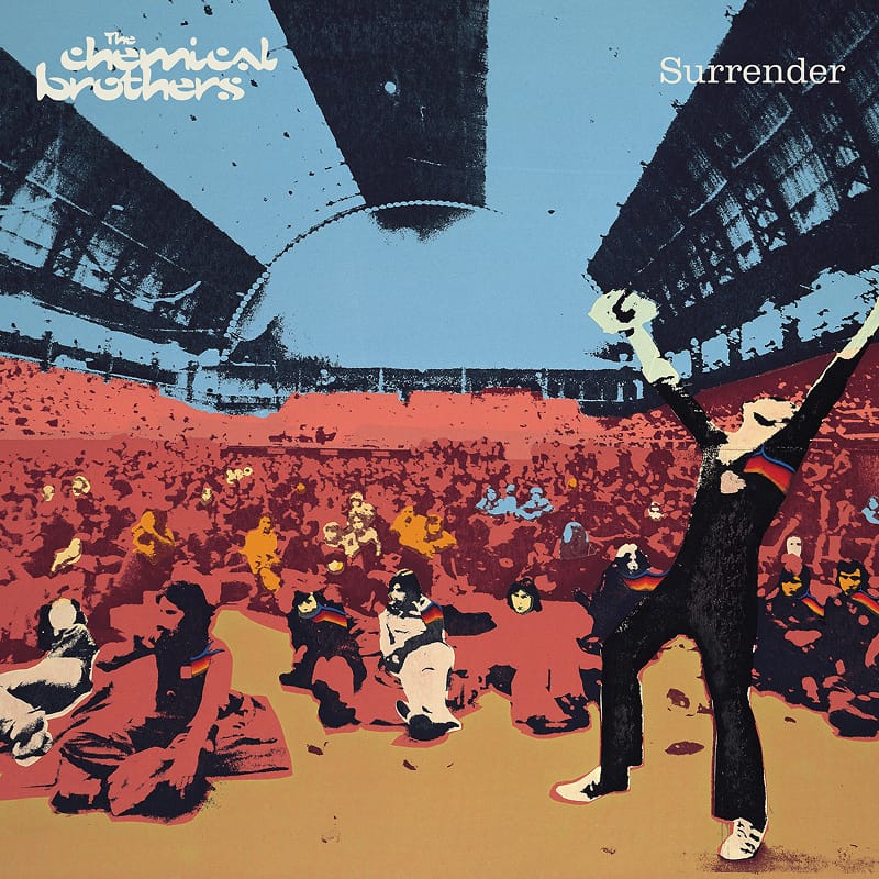 Concert crowd visual for The Chemical Brothers' Surrender, showing fans with hands raised at an outdoor venue.