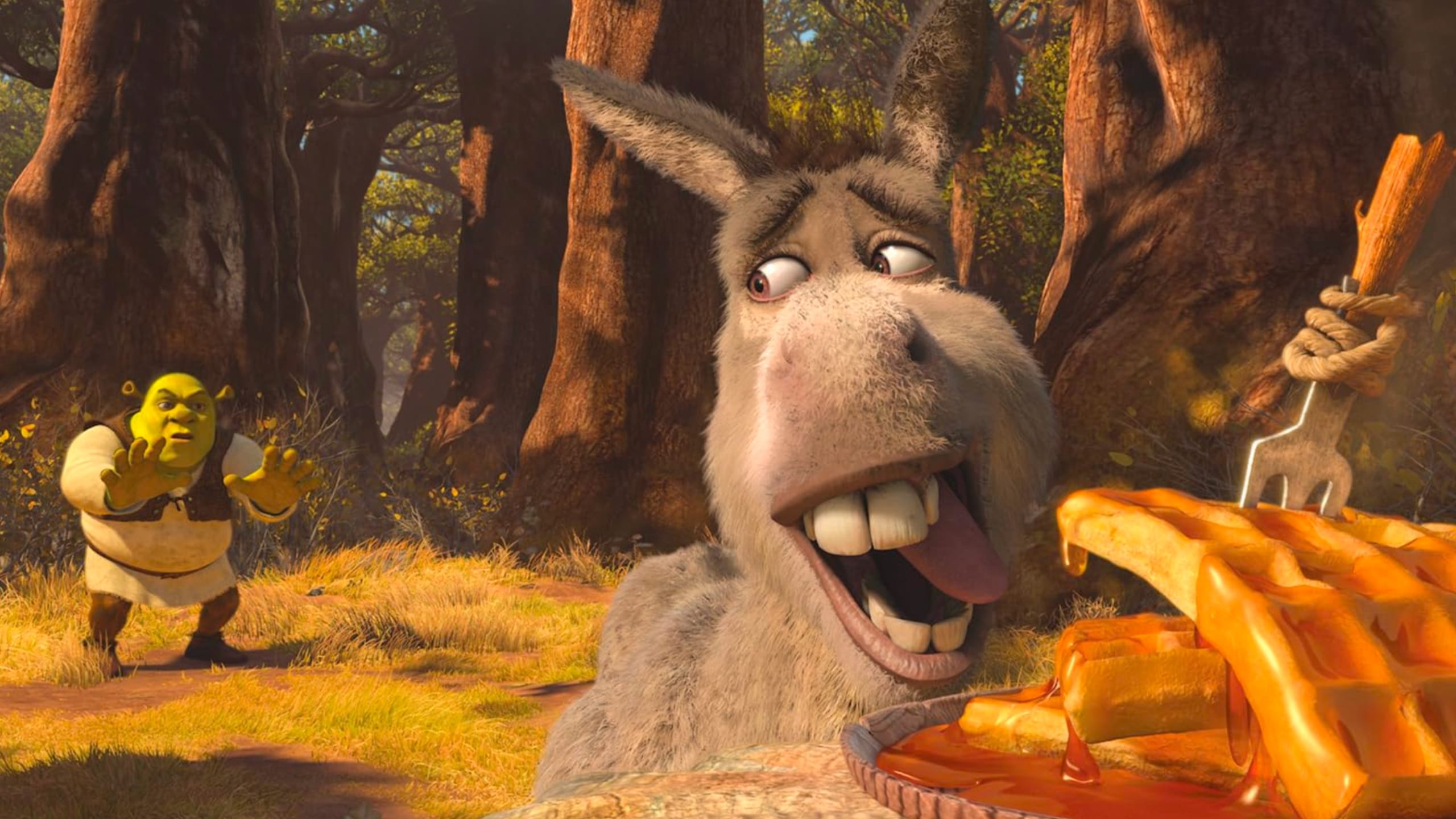 Donkey licking his lips excitedly in front of a stack of syrup-covered waffles with a wooden fork stuck in them, while Shrek cautiously approaches in the background forest.