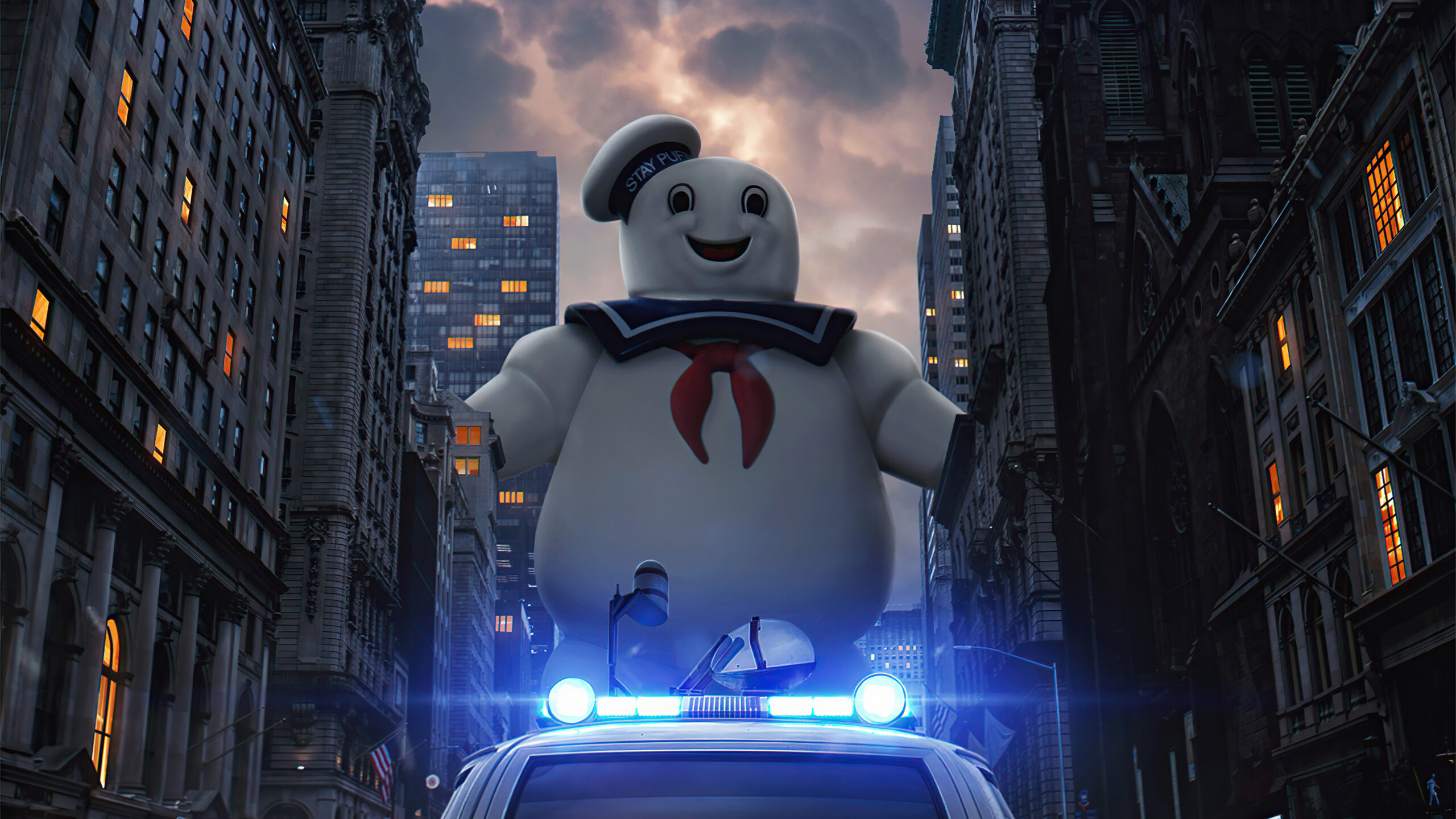 The Stay Puft Marshmallow Man towering over a city street at night, from Ghostbusters.